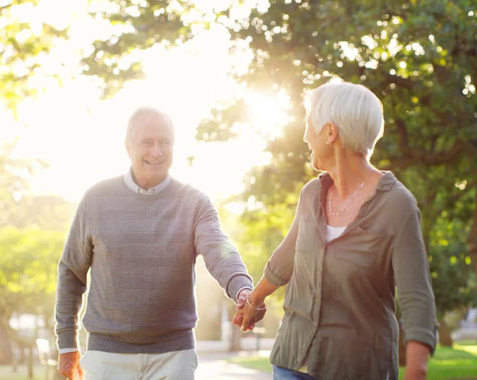 couple walking hand in hand outside