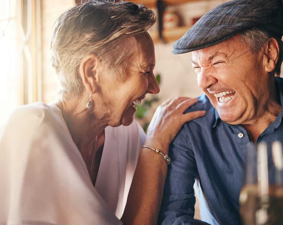 couple sharing some wine and some laughs