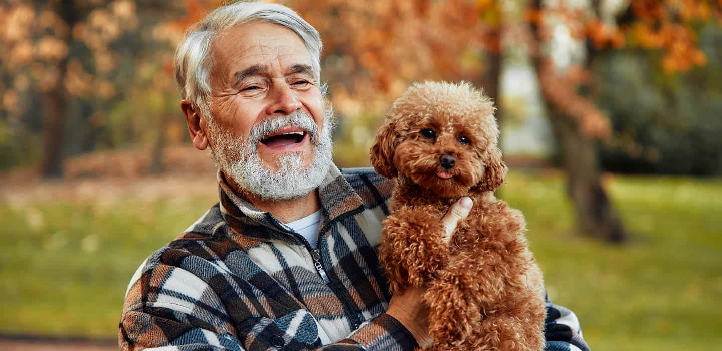 male resident holding a puppy